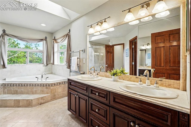 bathroom with a garden tub, tile patterned flooring, double vanity, and a stall shower