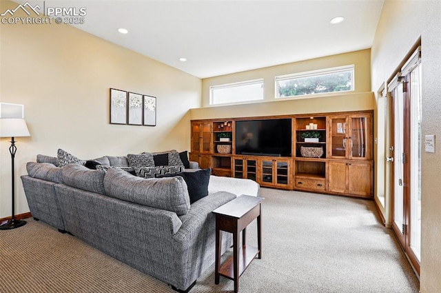 living room featuring carpet, plenty of natural light, and recessed lighting