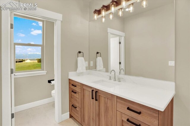 7871 Bannockburn Trl, Colorado Springs, CO 80908 - bathroom with baseboards, toilet, and vanity
