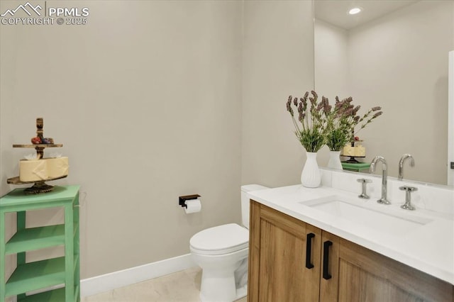 7871 Bannockburn Trl, Colorado Springs, CO 80908 - bathroom with toilet, baseboards, and vanity