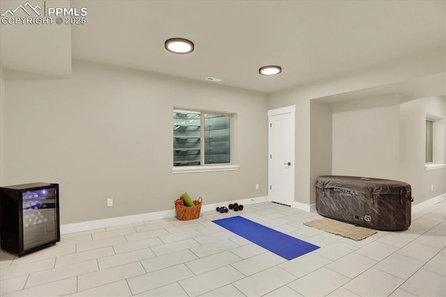 7871 Bannockburn Trl, Colorado Springs, CO 80908 - exercise room featuring baseboards and tile patterned floors
