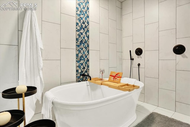 7871 Bannockburn Trl, Colorado Springs, CO 80908 - bathroom with tile walls, a soaking tub, and tiled shower