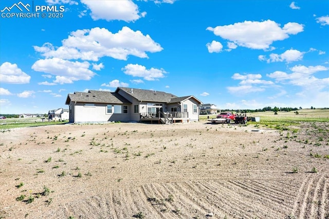 7871 Bannockburn Trl, Colorado Springs, CO 80908 - rear view of property featuring a wooden deck and a view of countryside