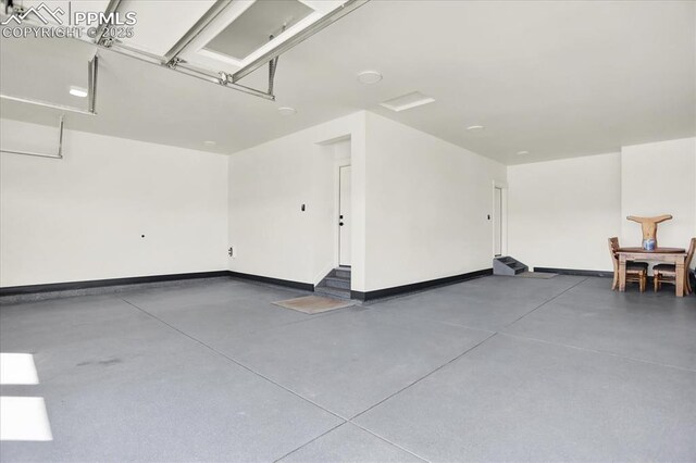 7871 Bannockburn Trl, Colorado Springs, CO 80908 - garage featuring baseboards