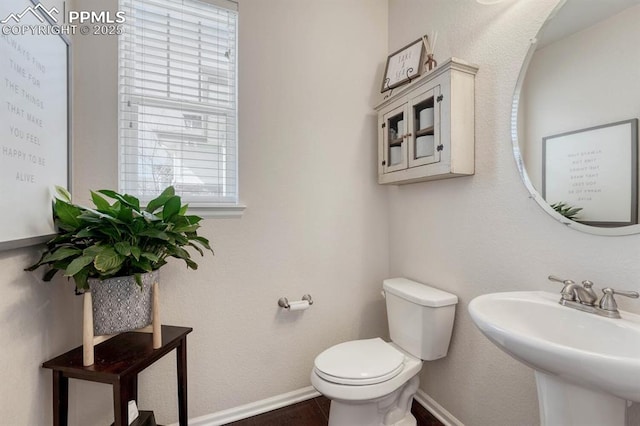 3793 Cadence Dr, Castle Rock, CO 80109 - half bathroom featuring healthy amount of natural light and wood finished floors