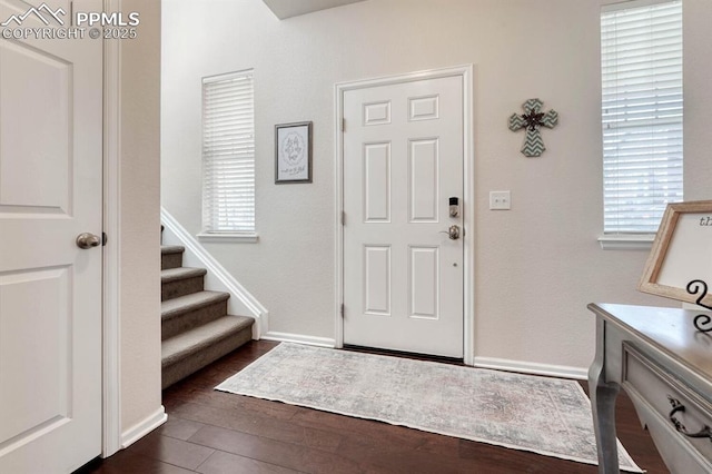 3793 Cadence Dr, Castle Rock, CO 80109 - foyer featuring dark wood-style floors and stairway