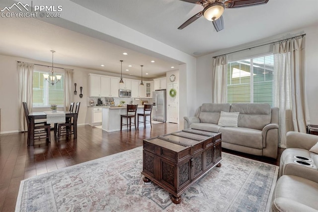 3793 Cadence Dr, Castle Rock, CO 80109 - living area with a ceiling fan, dark wood-type flooring, a chandelier, and recessed lighting