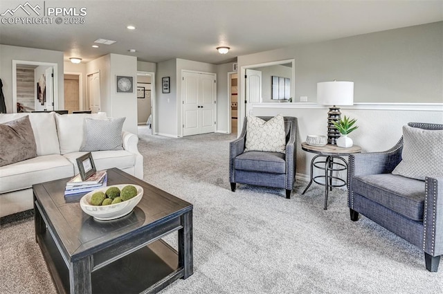 living room with carpet flooring, baseboards, and recessed lighting