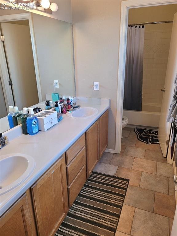 bathroom with toilet, double vanity, and shower / bath combo with shower curtain