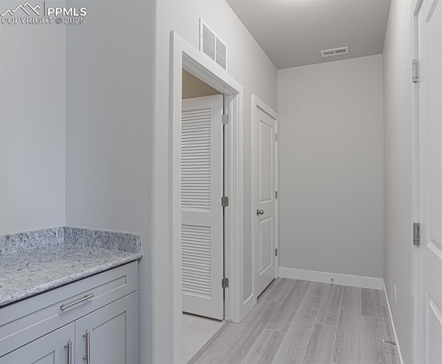6045 Miller Run Pl, Colorado Springs, CO 80924 - hall featuring light wood-style flooring and baseboards