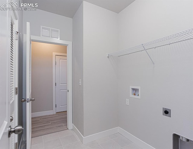 6045 Miller Run Pl, Colorado Springs, CO 80924 - laundry area with hookup for a washing machine, hookup for an electric dryer, baseboards, and light tile patterned floors