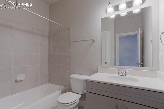 6045 Miller Run Pl, Colorado Springs, CO 80924 - bathroom featuring toilet, vanity, a textured wall, and tub / shower combination
