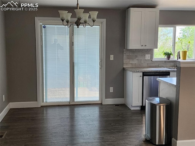 5427 Alteza Dr, Colorado Springs, CO 80917 - kitchen with dishwashing machine, baseboards, light countertops, and white cabinets