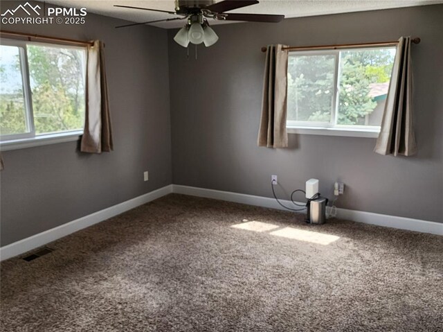 5427 Alteza Dr, Colorado Springs, CO 80917 - unfurnished room with dark carpet, a ceiling fan, and baseboards