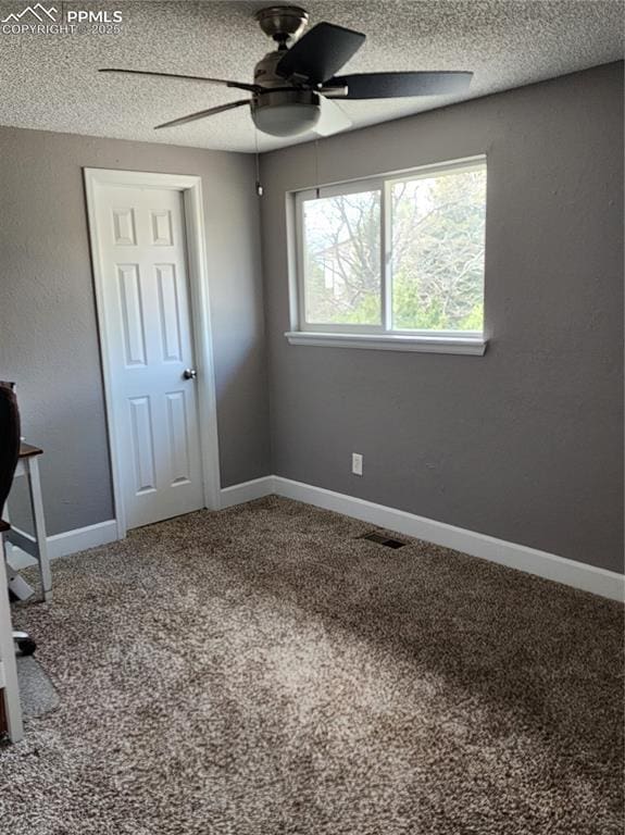 5427 Alteza Dr, Colorado Springs, CO 80917 - unfurnished bedroom with a textured ceiling, carpet flooring, baseboards, and a ceiling fan
