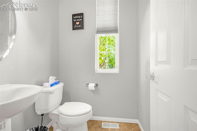 8147 Elk River Vw, Fountain, CO 80817 - bathroom with baseboards, toilet, and tile patterned floors