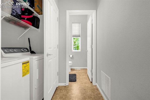 8147 Elk River Vw, Fountain, CO 80817 - laundry area with washer and clothes dryer and baseboards