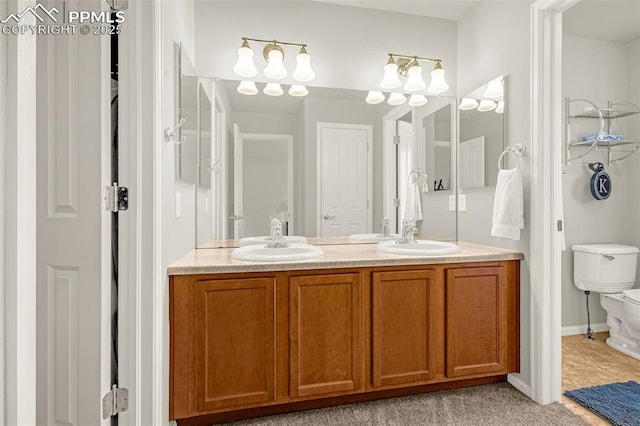 8147 Elk River Vw, Fountain, CO 80817 - full bathroom featuring double vanity and toilet