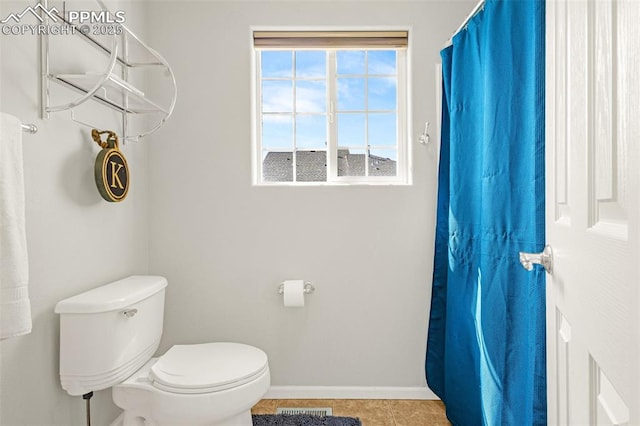 8147 Elk River Vw, Fountain, CO 80817 - full bathroom with toilet, baseboards, tile patterned floors, and a shower with shower curtain