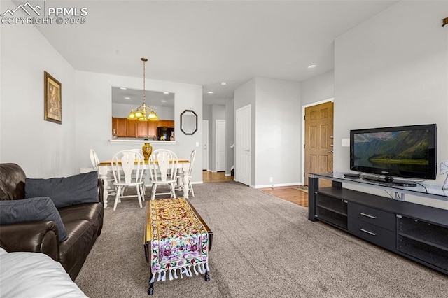 8147 Elk River Vw, Fountain, CO 80817 - carpeted living area featuring recessed lighting, baseboards, and a chandelier