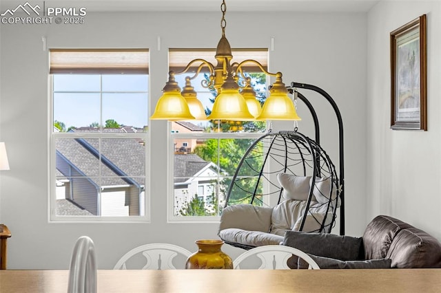 8147 Elk River Vw, Fountain, CO 80817 - dining room featuring healthy amount of natural light and a chandelier