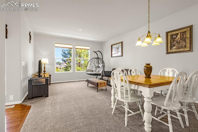 8147 Elk River Vw, Fountain, CO 80817 - dining area featuring a chandelier and baseboards