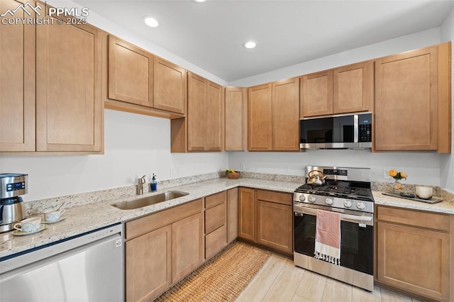 3565 Rosette Grv, Colorado Springs, CO 80910 - kitchen with stainless steel appliances, a sink, recessed lighting, and light stone counters