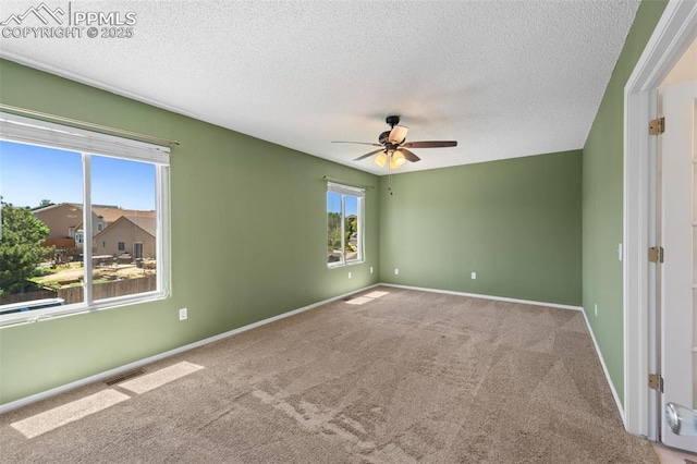4280 Solarglen Dr, Colorado Springs, CO 80916 - empty room featuring a ceiling fan, a textured ceiling, carpet, and baseboards