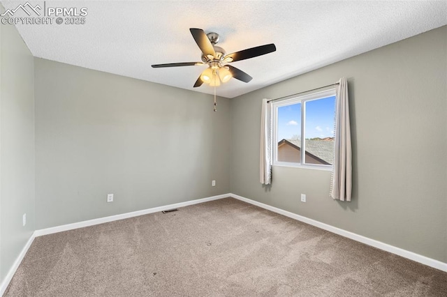 4280 Solarglen Dr, Colorado Springs, CO 80916 - empty room with carpet floors, baseboards, a ceiling fan, and a textured ceiling