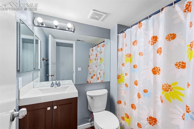 4280 Solarglen Dr, Colorado Springs, CO 80916 - full bathroom with vanity, toilet, a textured ceiling, and curtained shower