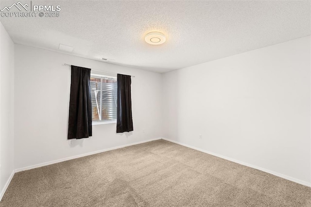 4280 Solarglen Dr, Colorado Springs, CO 80916 - empty room with carpet floors, a textured ceiling, and baseboards