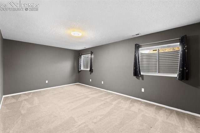 4280 Solarglen Dr, Colorado Springs, CO 80916 - spare room featuring carpet flooring, a textured ceiling, and baseboards