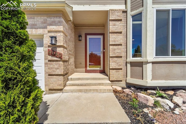4280 Solarglen Dr, Colorado Springs, CO 80916 - entrance to property with stone siding and brick siding