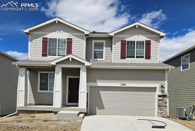 11384 Pikeminnow Pl, Colorado Springs, CO 80925 - view of front facade with an attached garage, driveway, and cooling unit