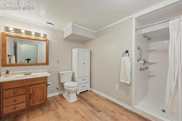 4765 Signal Rock Rd, Colorado Springs, CO 80922 - bathroom featuring a shower with shower curtain, wood finished floors, vanity, toilet, and baseboards