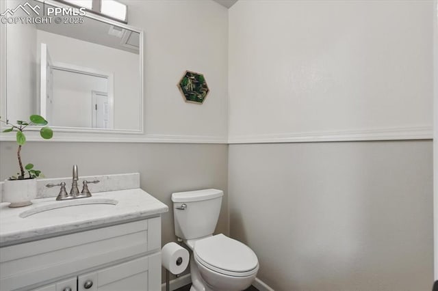 4765 Signal Rock Rd, Colorado Springs, CO 80922 - bathroom with vanity, toilet, and baseboards