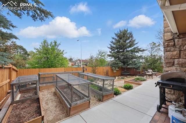 4765 Signal Rock Rd, Colorado Springs, CO 80922 - view of patio with a garden and a fenced backyard