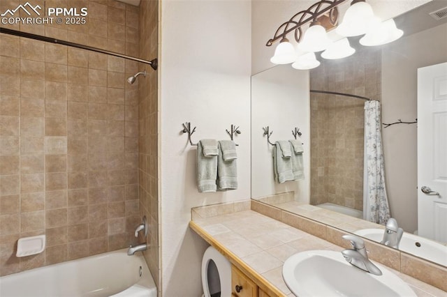 bathroom featuring shower / tub combo with curtain, a chandelier, and vanity