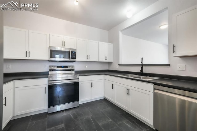 1833 Reilly Grv, Colorado Springs, CO 80951 - kitchen with stainless steel appliances, a sink, and dark countertops