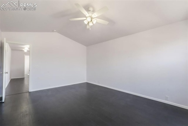 1833 Reilly Grv, Colorado Springs, CO 80951 - spare room featuring vaulted ceiling, dark wood finished floors, a ceiling fan, and baseboards