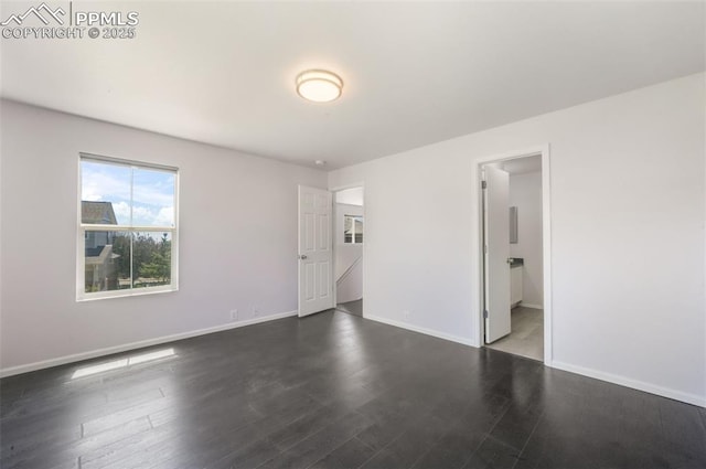 1833 Reilly Grv, Colorado Springs, CO 80951 - empty room with baseboards and wood finished floors