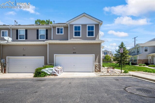 1833 Reilly Grv, Colorado Springs, CO 80951 - multi unit property with a garage and concrete driveway