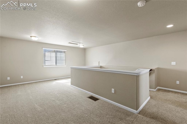 6646 Backcountry Loop, Colorado Springs, CO 80927 - empty room with a smoke detector, light carpet, and a textured ceiling