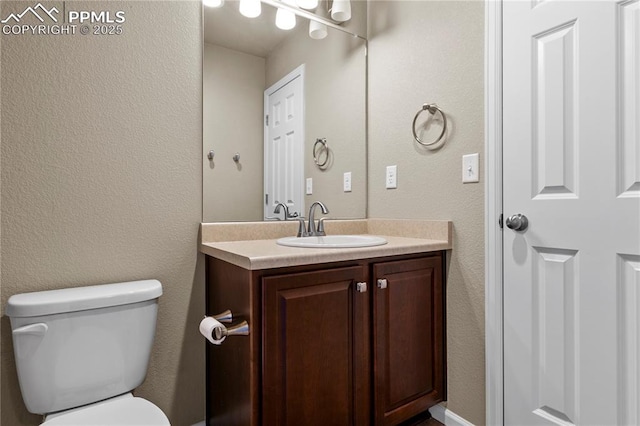 6646 Backcountry Loop, Colorado Springs, CO 80927 - half bathroom with vanity and a textured wall