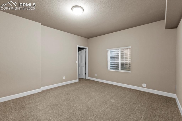 6646 Backcountry Loop, Colorado Springs, CO 80927 - carpeted spare room featuring baseboards and a textured ceiling
