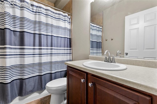 6646 Backcountry Loop, Colorado Springs, CO 80927 - bathroom featuring vanity, shower / tub combo with curtain, and a textured wall