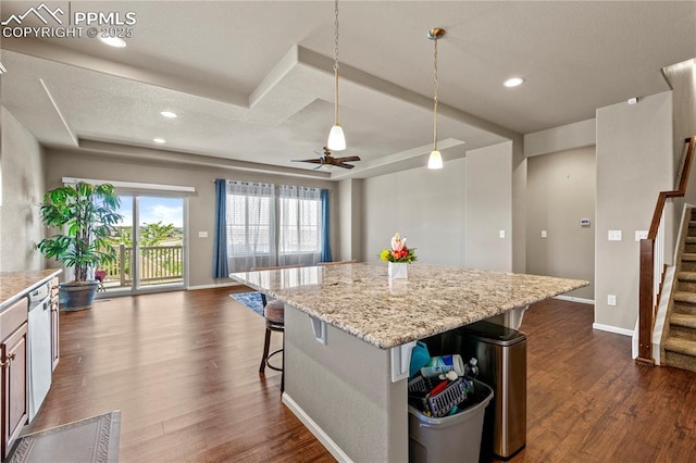 6646 Backcountry Loop, Colorado Springs, CO 80927 - kitchen featuring open floor plan, dark wood-style floors, a center island, a kitchen breakfast bar, and recessed lighting