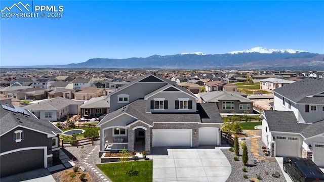 6317 Chagall Trl, Colorado Springs, CO 80924 - traditional-style home featuring a residential view, driveway, a porch, and a shingled roof