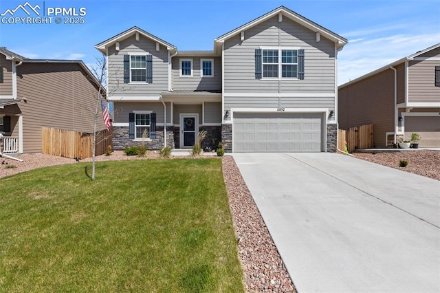 11052 Bossett Dr, Peyton, CO 80831 - view of front of home featuring an attached garage, stone siding, and driveway