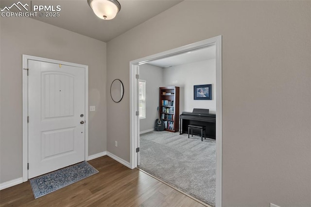 11052 Bossett Dr, Peyton, CO 80831 - entrance foyer with wood finished floors and baseboards